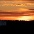 Grain silo at sunset