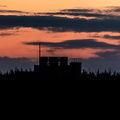 Grain silo at sunset